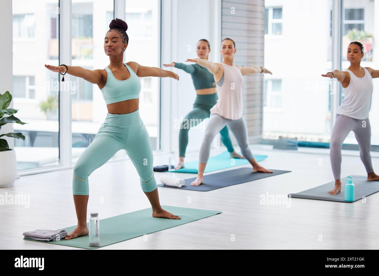 Yoga warrior pose and women with coach in class for exercise fitness and balance. Yogi girls and group practice for holistic wellness body healthy Stock Photo Alamy