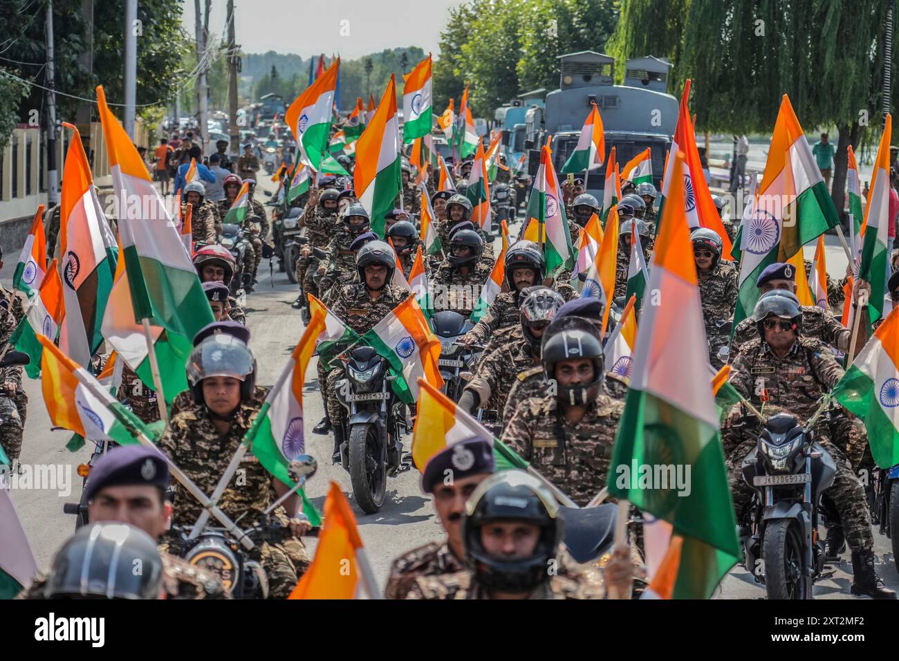 Indian paramilitary officers participate during a motorcycle rally ...