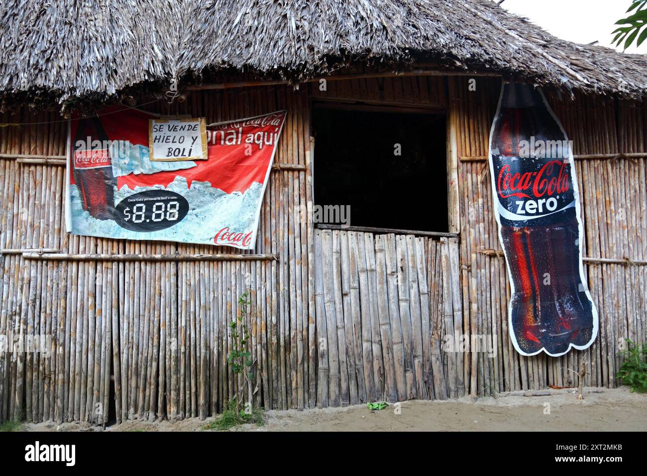 Coca Cola Zero advert on wall of a typical bamboo and palm leaf thatch hut, Carti Yandup Island, San Blas Islands, Panama Stock Photo