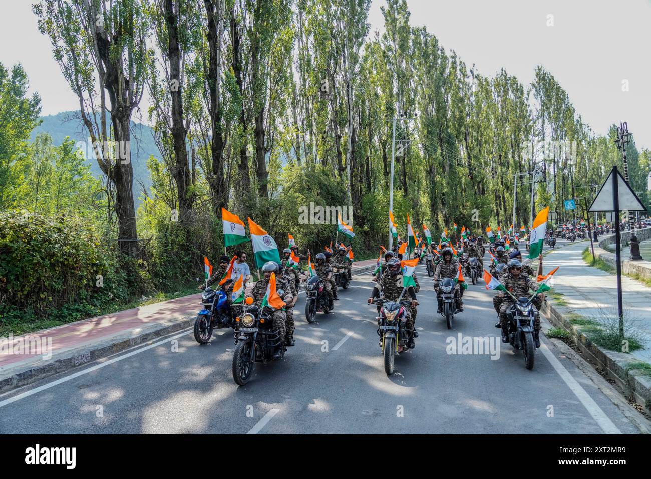 Indian paramilitary officers participate during a motorcycle rally ...