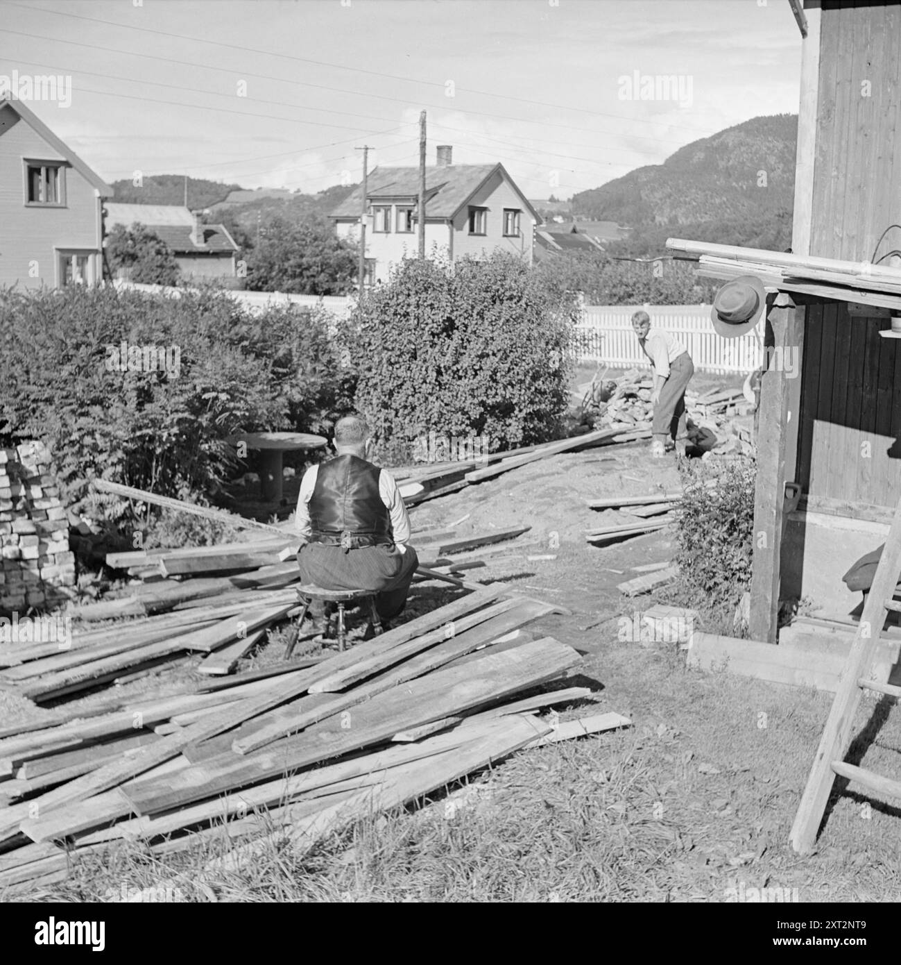 Current 18-1949: Old man Nygårdsvold turns 70 Former Prime Minister Johan Nygårdsvold turns 70 on 6 September 1949. He has retired to his home in Hommelvik and spends his time refurbishing the house. - Placed in the sun grill just outside the outhouse, he is at his best.  'But the sun hardly shines in Trøndelag this year,' he says.  'It looks like the whole village is going to float away, that's how it's raining'  Photo; Per Bratland / Aktuell / NTB  ***PHOTO NOT IMAGE PROCESSED***    This image text is auto translated   This image text is auto translated Stock Photo