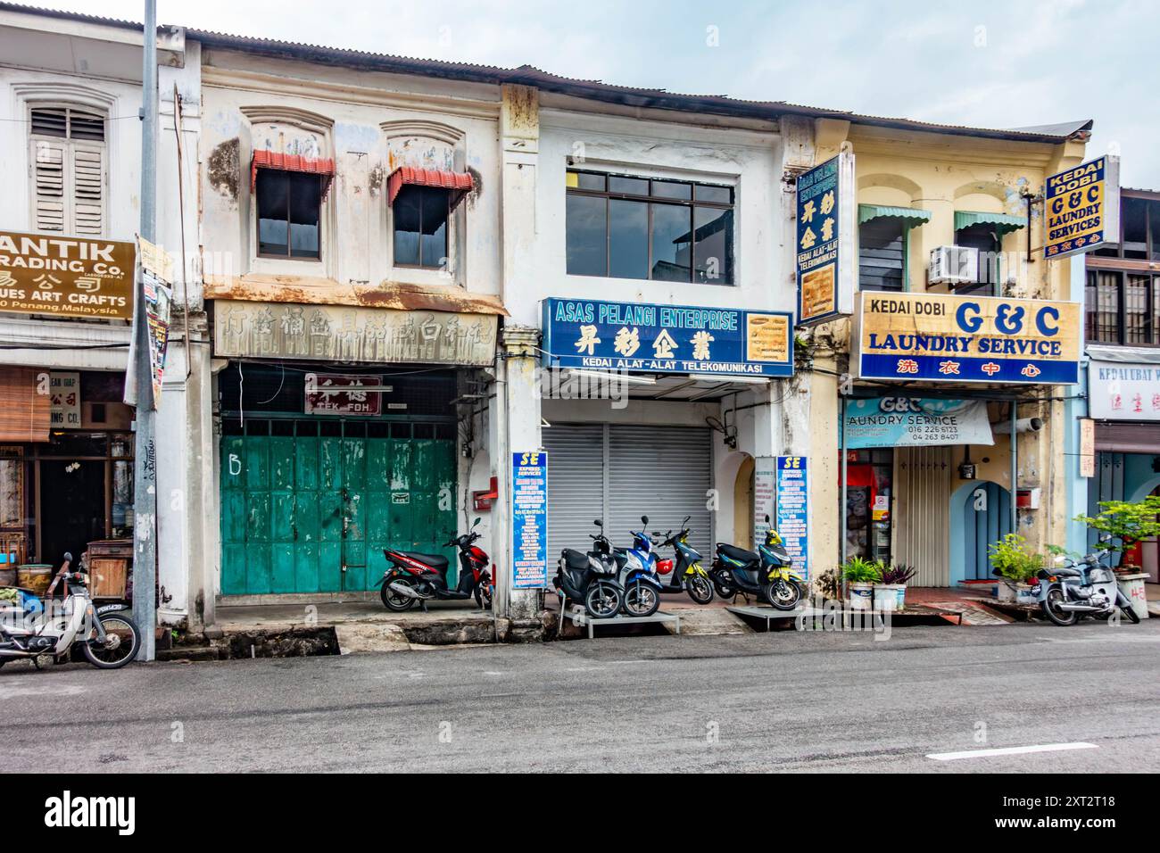 A view along Chulia Street, one of the oldest streets in George Town ...