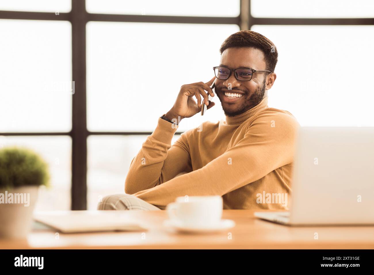 Happy afro student talking on the phone Stock Photo