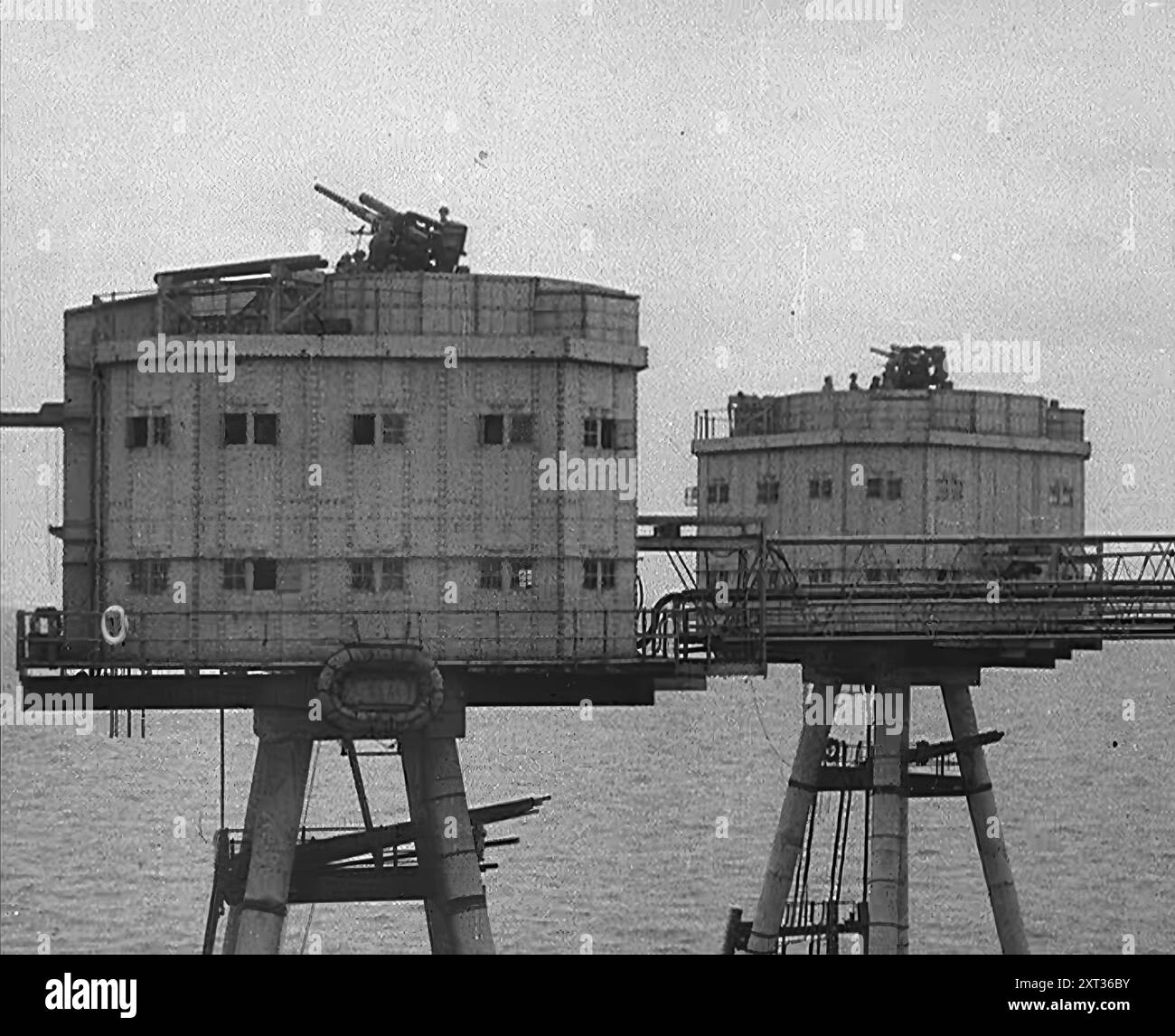 Anti-Aircraft Guns on a British Maunsell Army Fort Off the British Coast, 1940. Second World War. 'The British coastline is over 2000 miles in circumference. Defences in any given spot were meagre, and in nearly all cases inadequate'. From &quot;Time To Remember -  Standing Alone&quot;, 1940 (Reel 2); documentary film about events of later months of 1940. Stock Photo