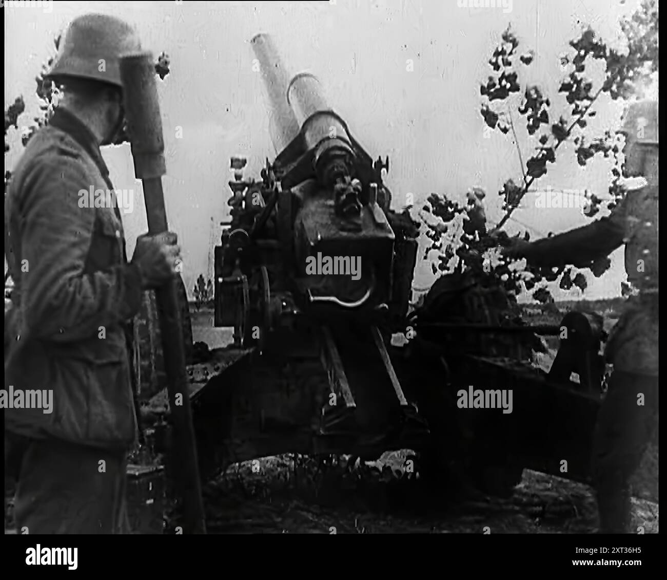 Two Male German Soldiers by an Artillery Gun, 1939. From &quot;Time To Remember -  The Reluctant Warriors&quot;, 1939 ( Reel 2); documentary about events of 1939 - preparations for war and then hostilities break out. Stock Photo