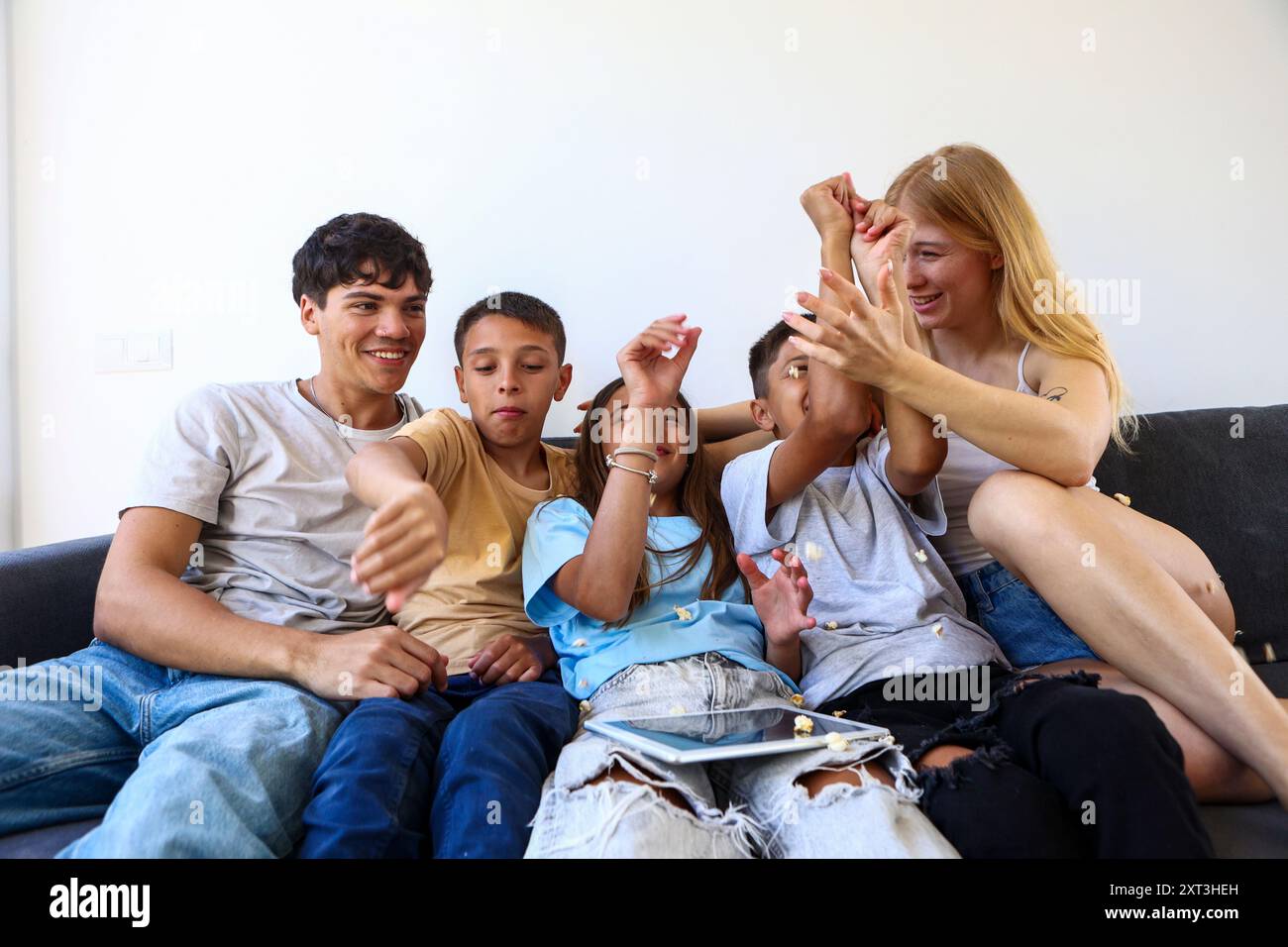 Triplets bond with their siblings, playfully interacting and laughing ...