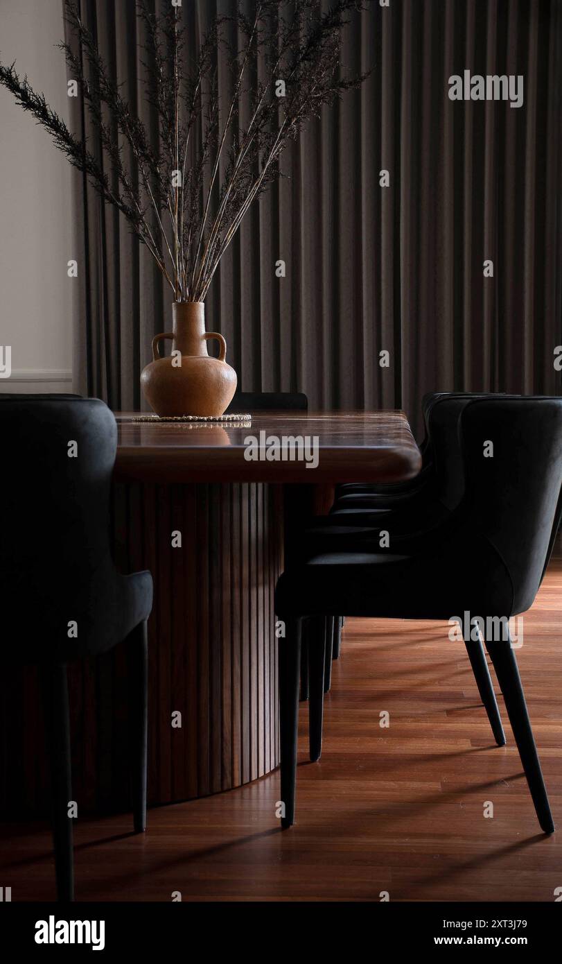 A chic interior featuring a modern dining table and chairs set against ...