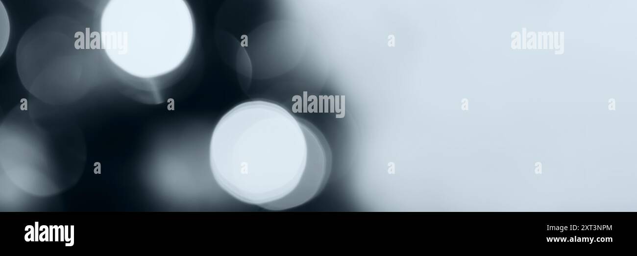 Blurred lights, gray, deep blue background, banner texture. Abstract bokeh with soft light header. Wide screen wallpaper. Panoramic web banner with co Stock Photo