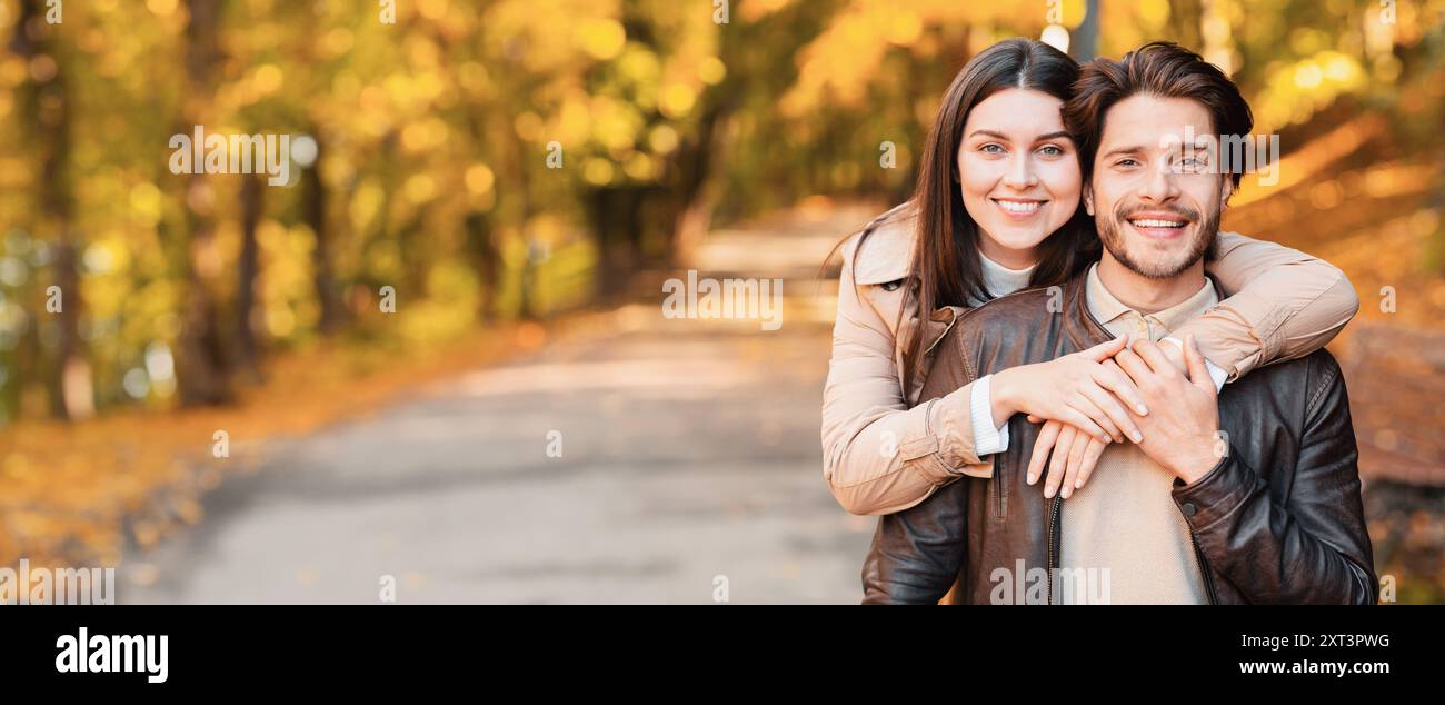 Family portrait of young couple posing at forest Stock Photo - Alamy