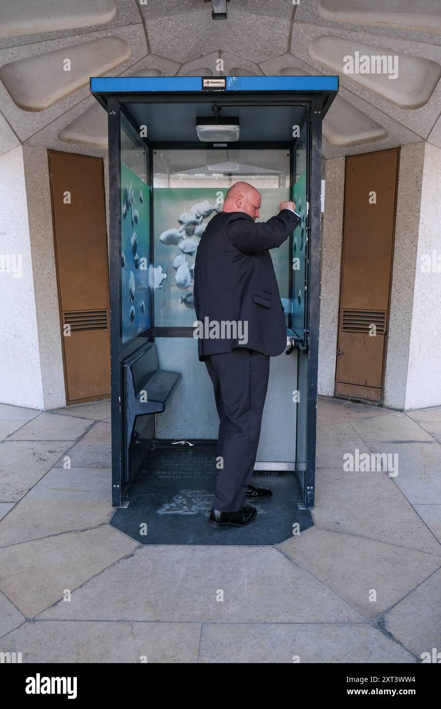 London, UK, 13th August, 2024. The police sentry box featuring a piranha artwork by Banksy has temporarily been moved to Guildhall Yard for safety reasons, whilst a permanent home for it is decided. Pieces by the elusive artist have previously been defaced or stolen. Credit: Eleventh Hour Photography/Alamy Live News Stock Photo