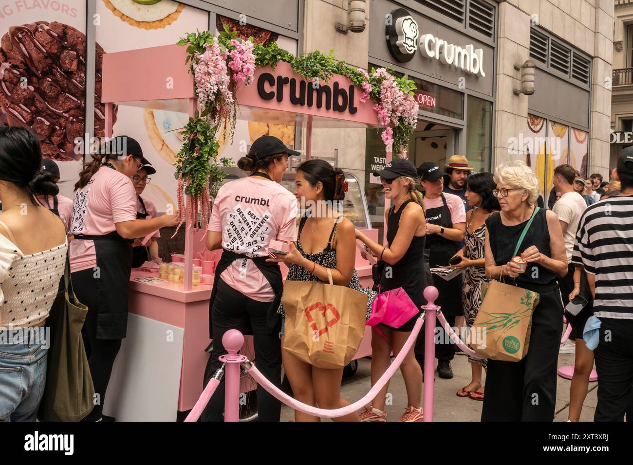 Cookie lovers rush to the Crumbl store in Chelsea in New York on Friday, August 9, 2024 to celebrate the release and receive a free sample of CrumblÕs ÒSpecial DessertsÓ. (© Richard B. Levine) Stock Photo