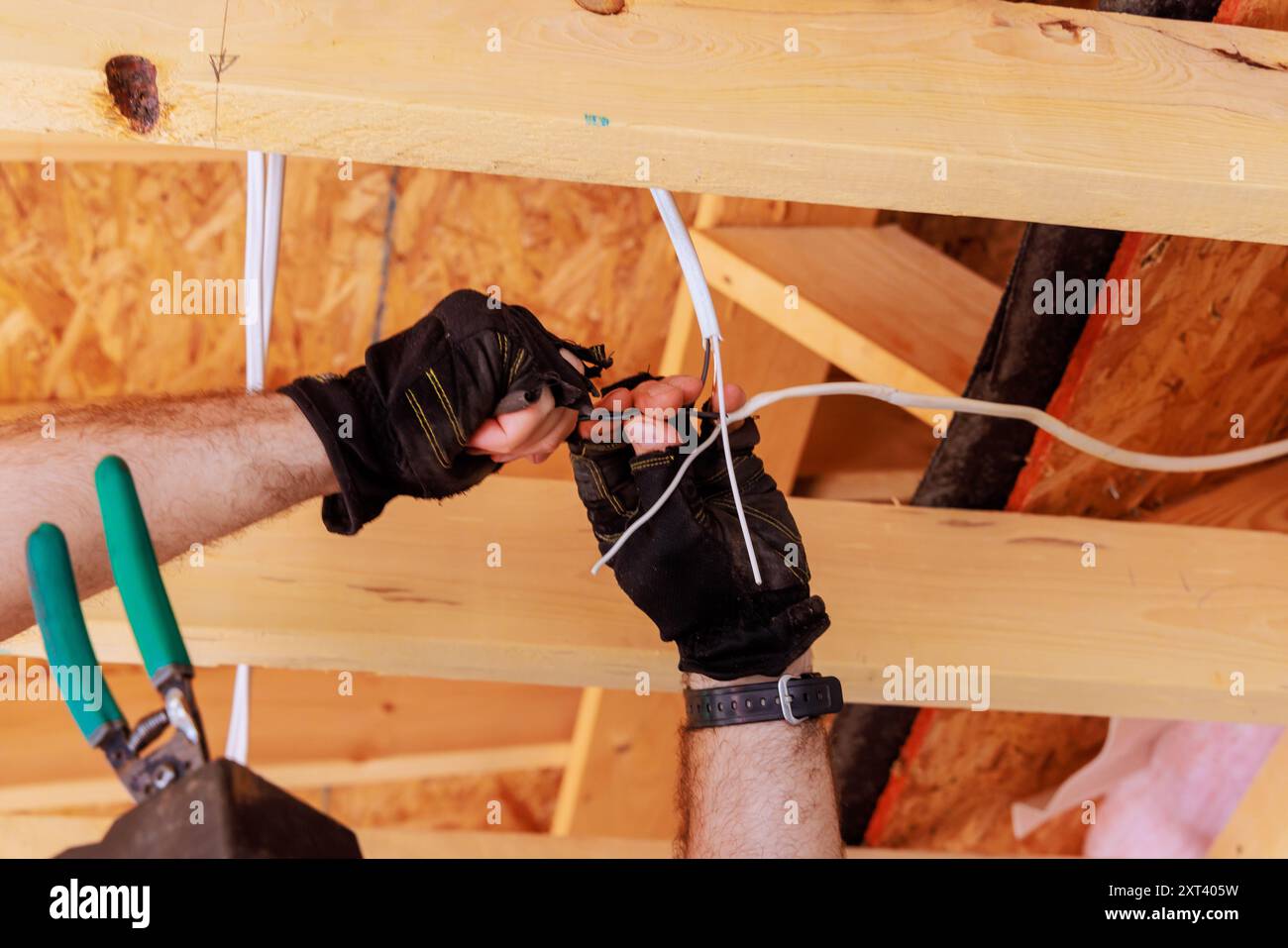 Wiring ceiling light lamp electrical is mounted by an electrician Stock