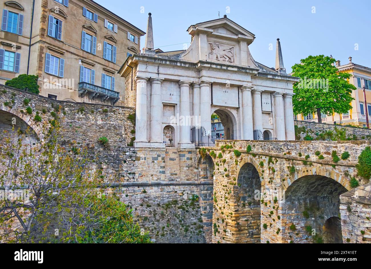 The medieval sculptured Porta San Giacomo gate and arched bridge ...