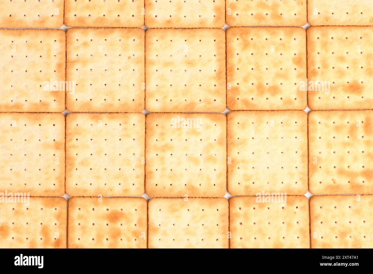 Square shortbread cookies background. Stacked butter biscuits for coffee or tee. High resolution photo. Full depth of field. Stock Photo