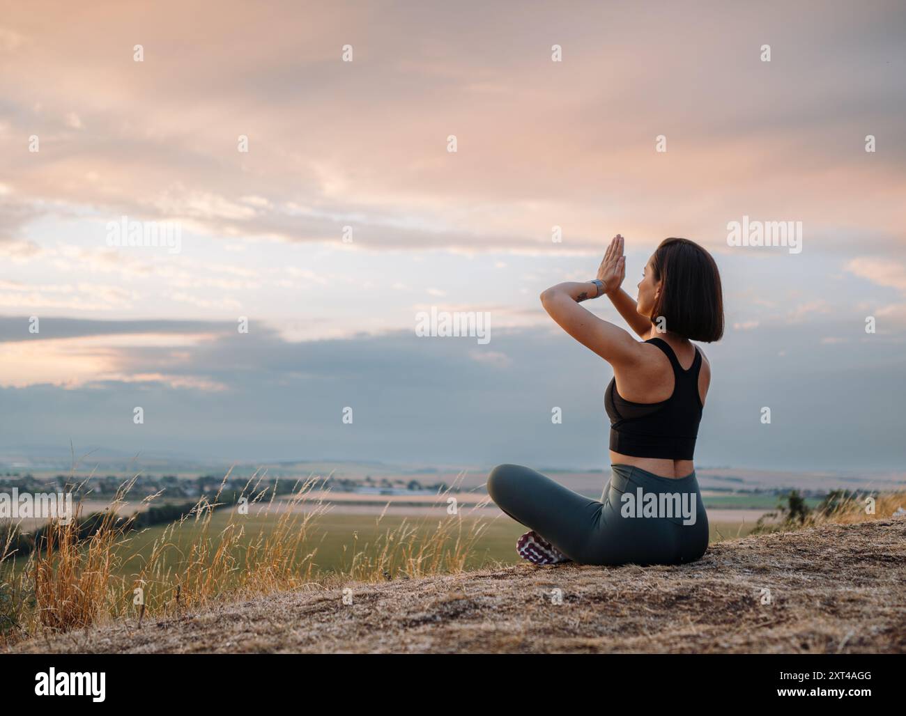 Woman practices meditation amidst hi-res stock photography and images ...