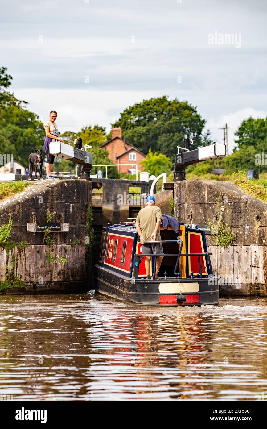 Canal narrowboat about to enter the Llangollen canal at Hurleston  junction bottom lock no1 after leaving the Shropshire union canal Cheshire Stock Photo