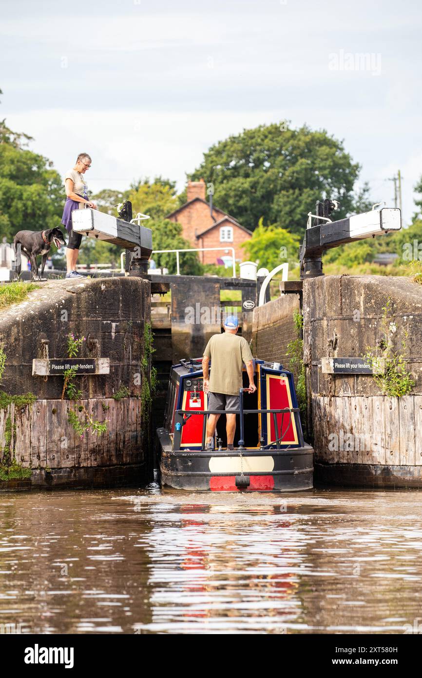 Canal narrowboat about to enter the Llangollen canal at Hurleston  junction bottom lock no1 after leaving the Shropshire union canal Cheshire Stock Photo