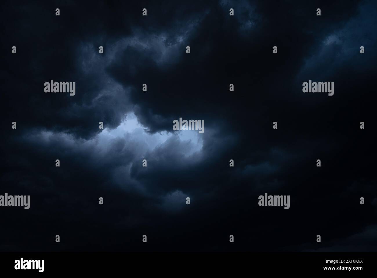 dark thundercloud (cumulonimbus) seen from below Stock Photo