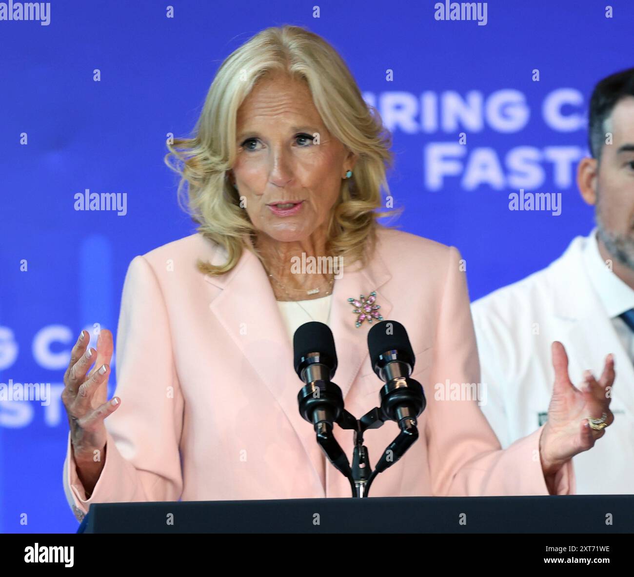 New Orleans, USA. 13th Aug, 2024. First Lady Dr. Jill Biden speaks while standing between President Joe Biden and Dr. Quincy Brown during the Biden Cancer Moonshot Event at the A.B. Freeman School of Business on Tulane University's campus in New Orleans, Louisiana on Tuesday, August 13, 2024. (Photo by Peter G. Forest/Sipa USA) Credit: Sipa USA/Alamy Live News Stock Photo