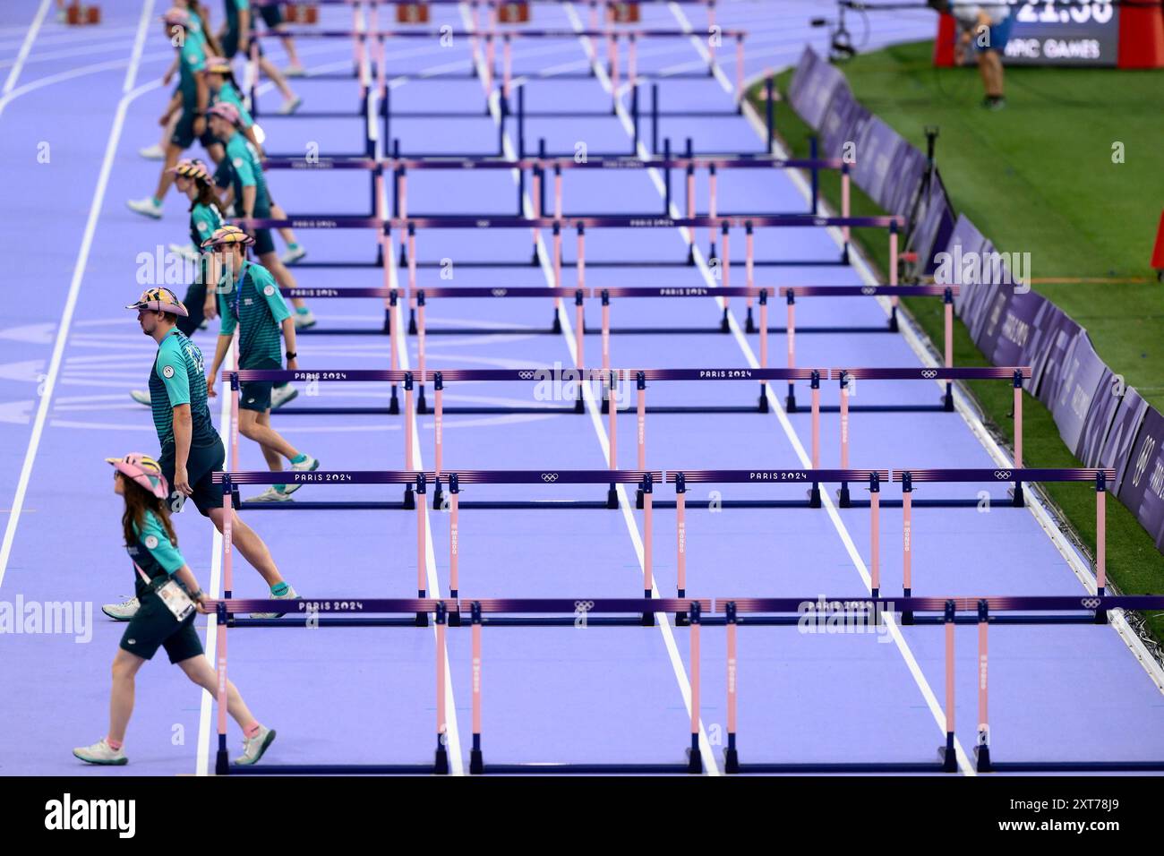 Volounteers Prepare Hurdles Before The Women s 100m Hurdles During The volounteers-prepare-hurdles-before-the-women-s-100m-hurdles-during-the