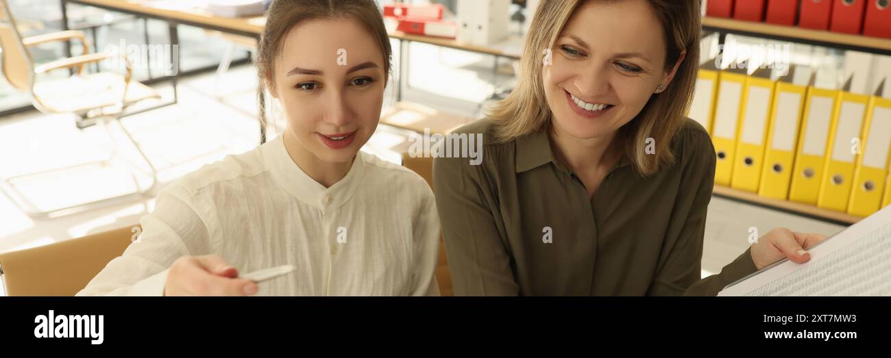 Smiling colleagues discussing new start-up in office Stock Photo