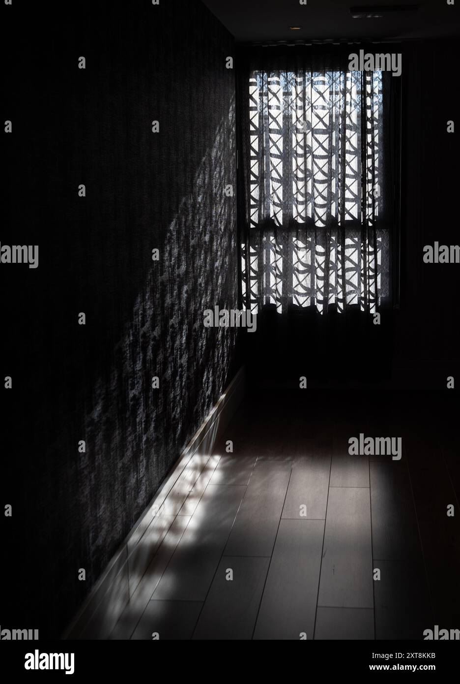 Dark room with patterned curtains Stock Photo Alamy