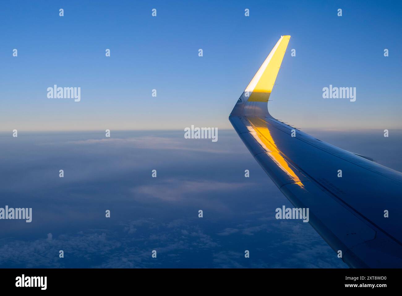 Airplane wing above clouds Stock Photo - Alamy
