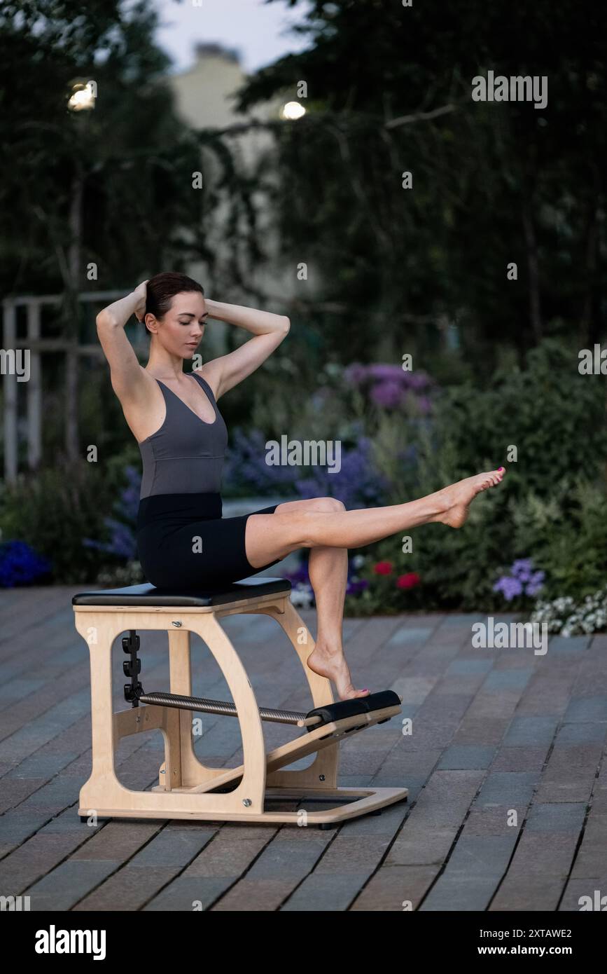Pilates reformer chair woman fitness yoga gym exercise. Correction of ...
