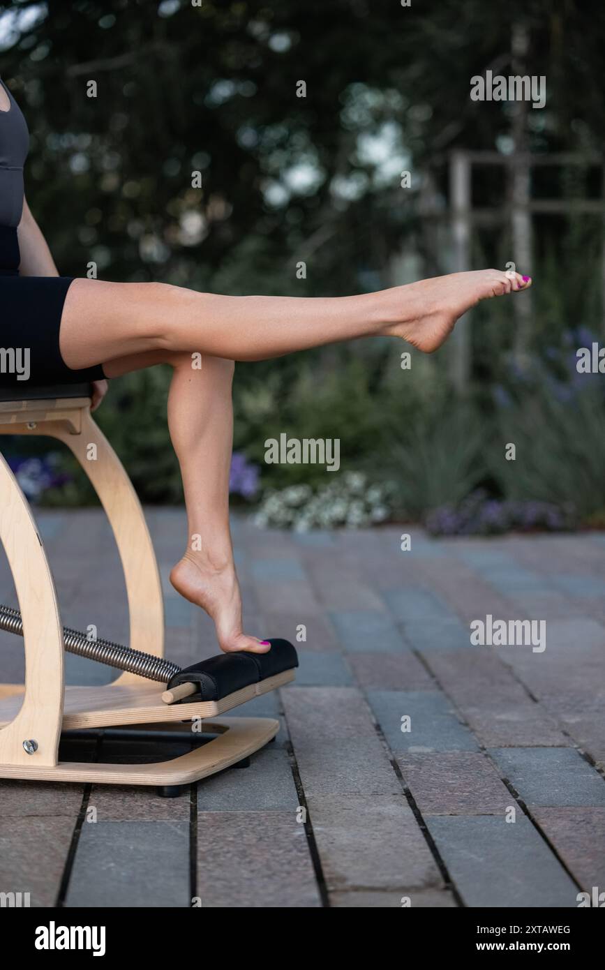 Pilates reformer chair woman fitness yoga gym exercise. Correction of ...
