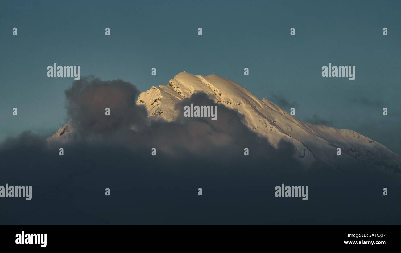 Snow mountain in the clouds on the Italian alps Stock Photo - Alamy