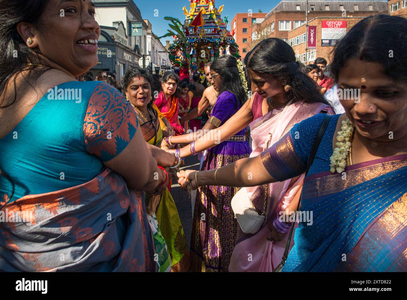 Women Devotees Helping To Pull One Of The Chariots During The Tamil women-devotees-helping-to-pull-one-of-the-chariots-during-the-tamil