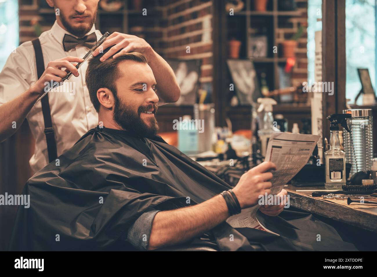 Young man reading newspaper 30s hi-res stock photography and images - Alamy