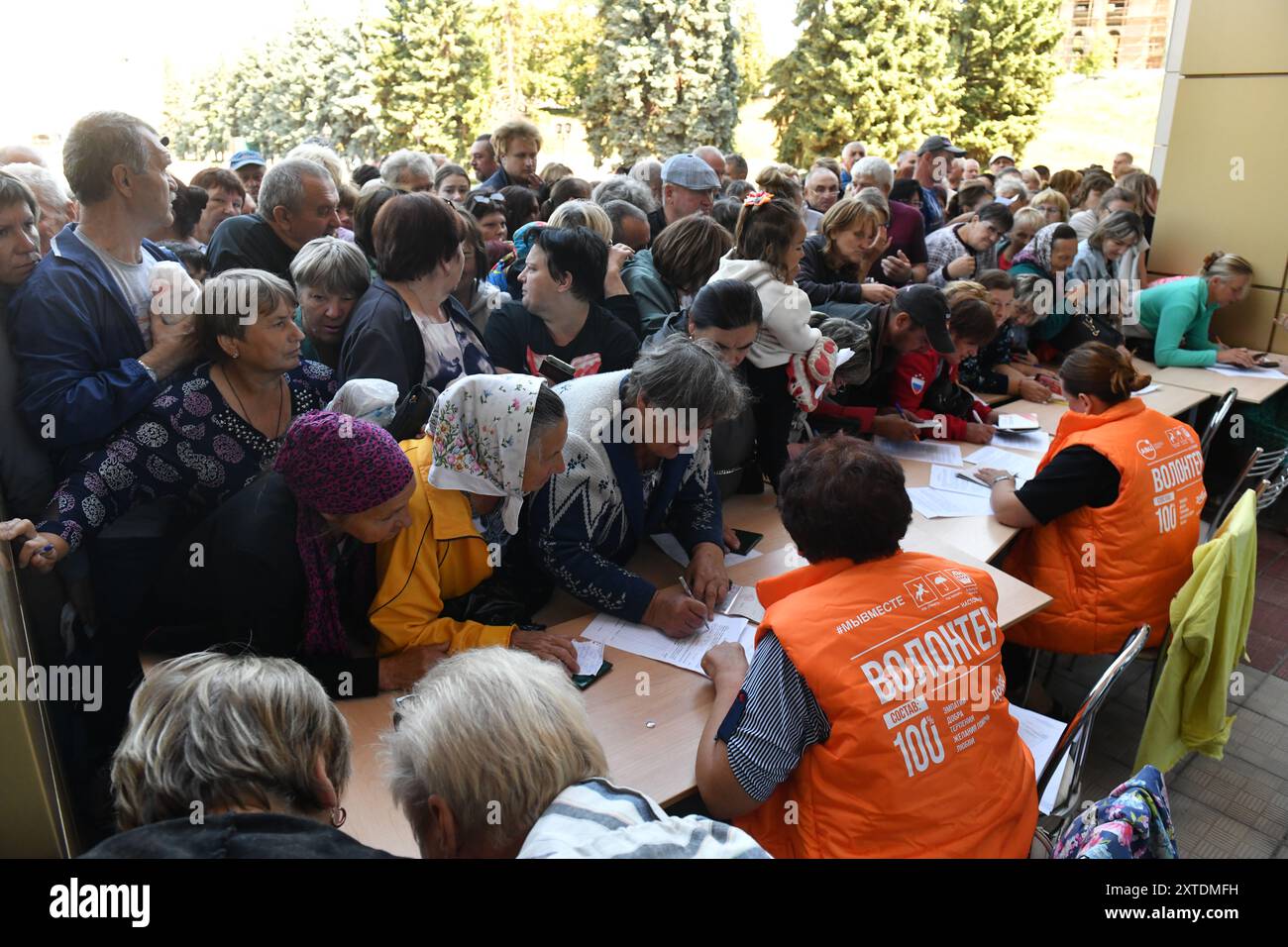 Kursk, Russia. 14th Aug, 2024. People receive relief supplies in Kursk, Russia, Aug. 14, 2024. Credit: Str/Xinhua/Alamy Live News Stock Photo