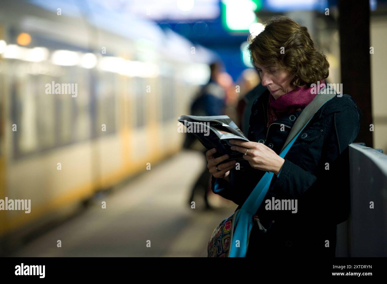 Waiting Commuter Reading Magazine Adult, Caucasian, Female Commuter ...