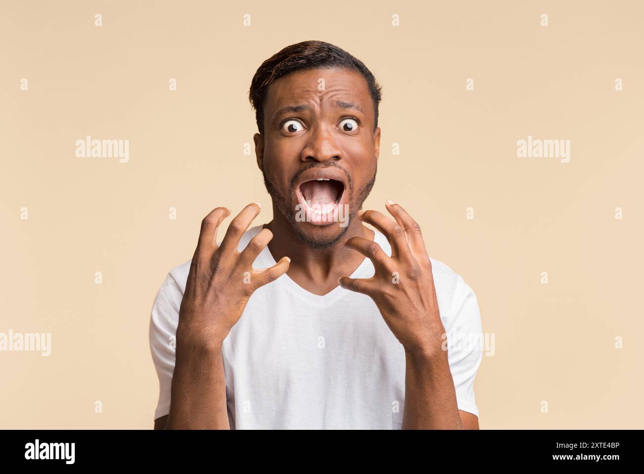 Surprised afro man shouting hi-res stock photography and images - Alamy
