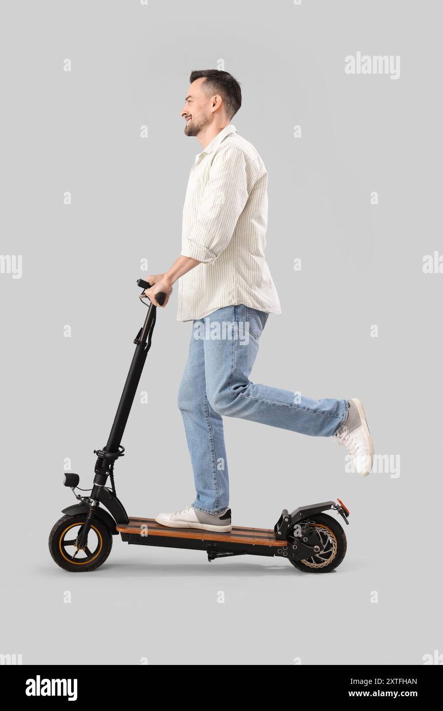 Delivery guy riding electric bike hi-res stock photography and images ...