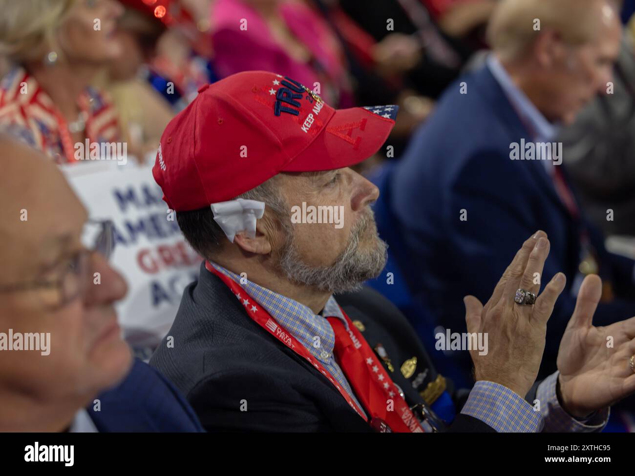 MILWAUKEE, Wis. – July 18, 2024: Attendees at the 2024 Republican National Convention watch the proceedings in the Fiserv Forum. Stock Photo