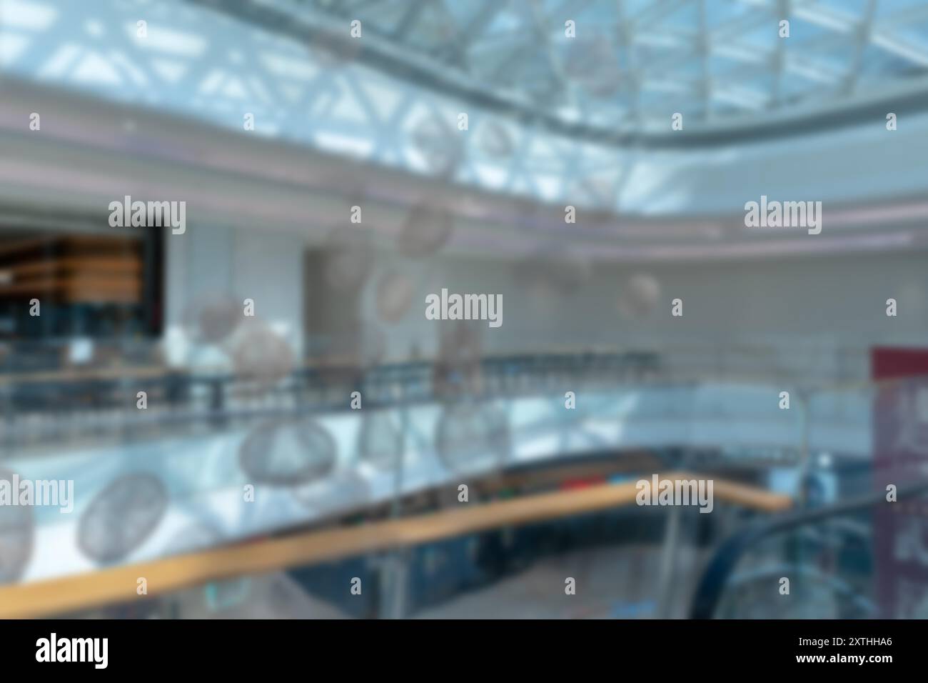 A blurred image of a modern shopping mall in Shenzhen, China. The image ...