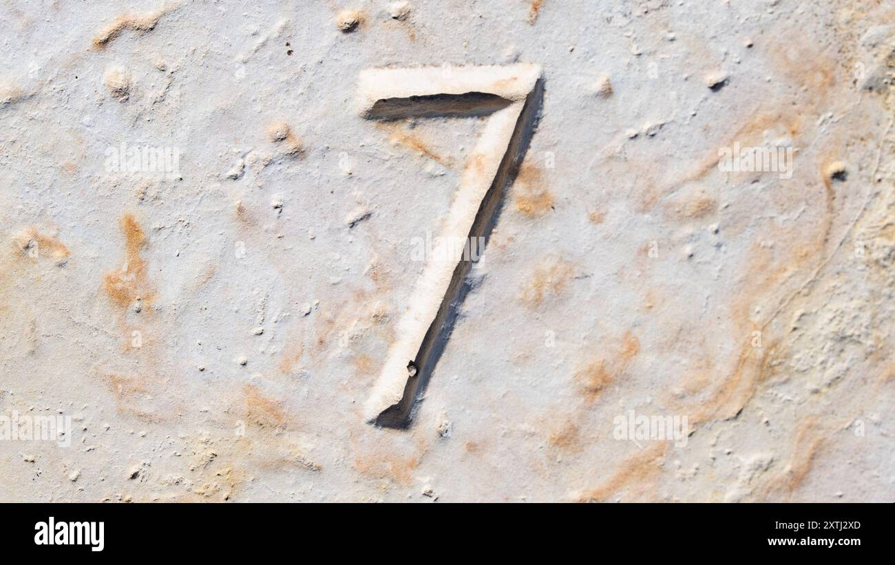 WORLD AMPERSAND DAY. World Statistics Day. National Numeracy Day. Close-up of the Number 6 Etched, Carved in Stone. Calendar Day 7. Estonia Stock Photo