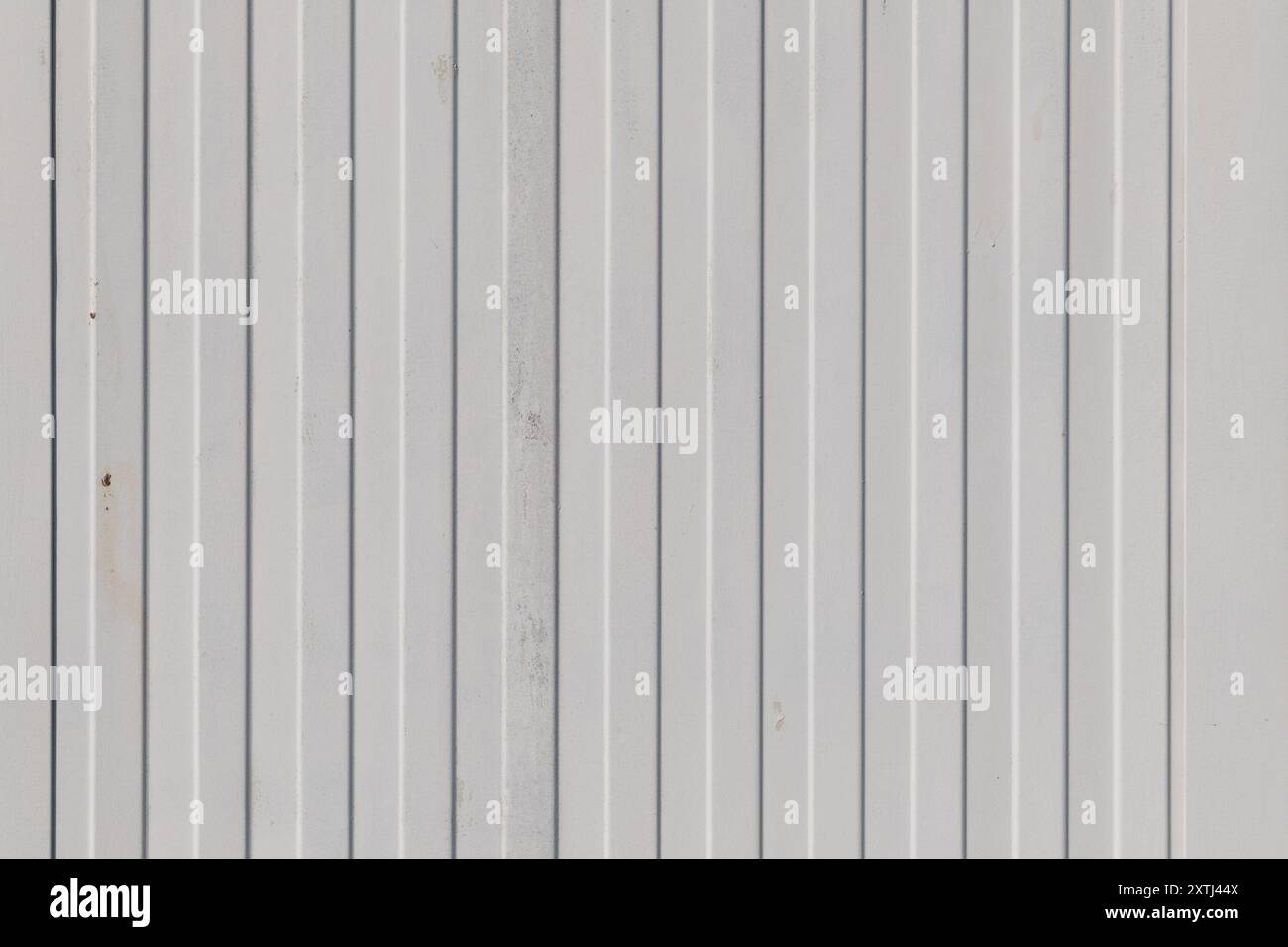 Old white painted corrugated galvanized iron. Backgrounds and textures. Stock Photo