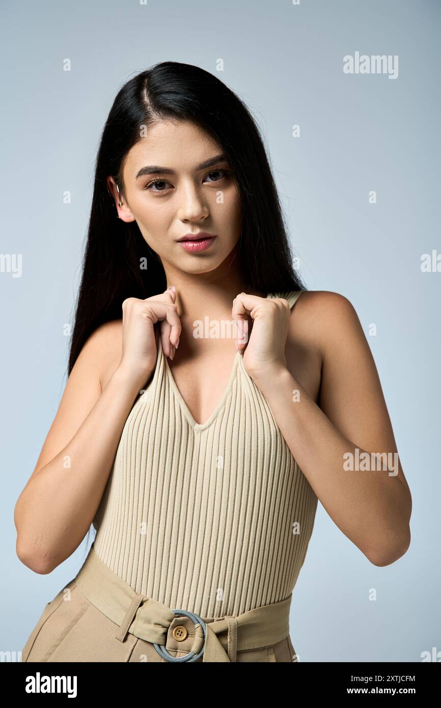 Female wearing beige top hi-res stock photography and images - Alamy
