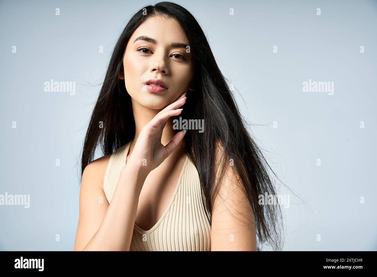 Female wearing beige top hi-res stock photography and images - Alamy
