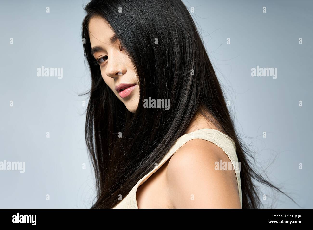 Long black hair blue dress hi-res stock photography and images - Alamy