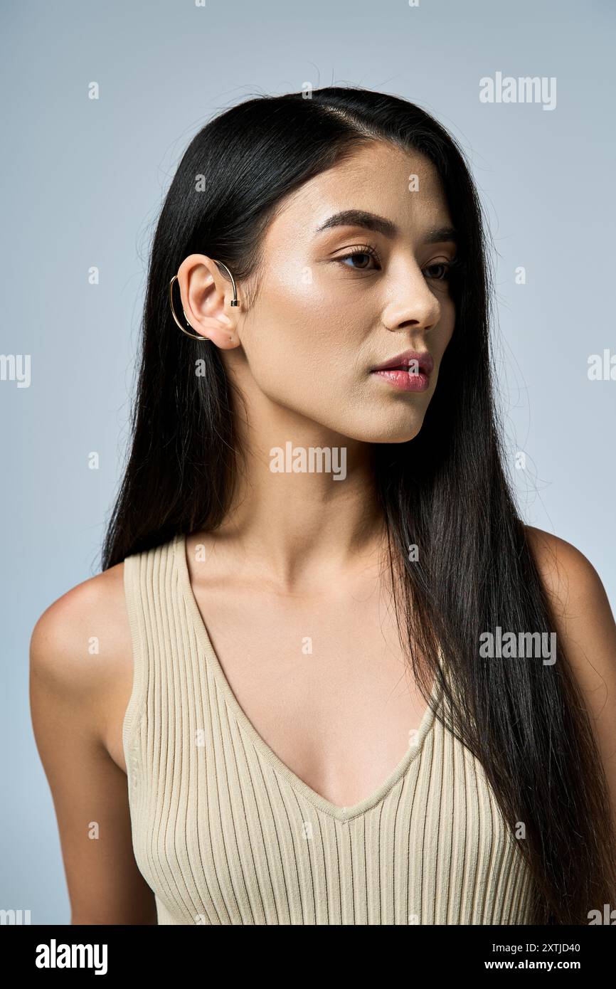 Female wearing beige top hi-res stock photography and images - Alamy