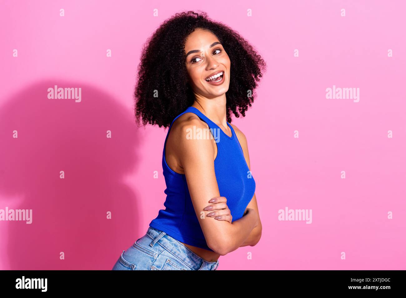 Photo of positive girl with crossed hands look profile side isolated ...