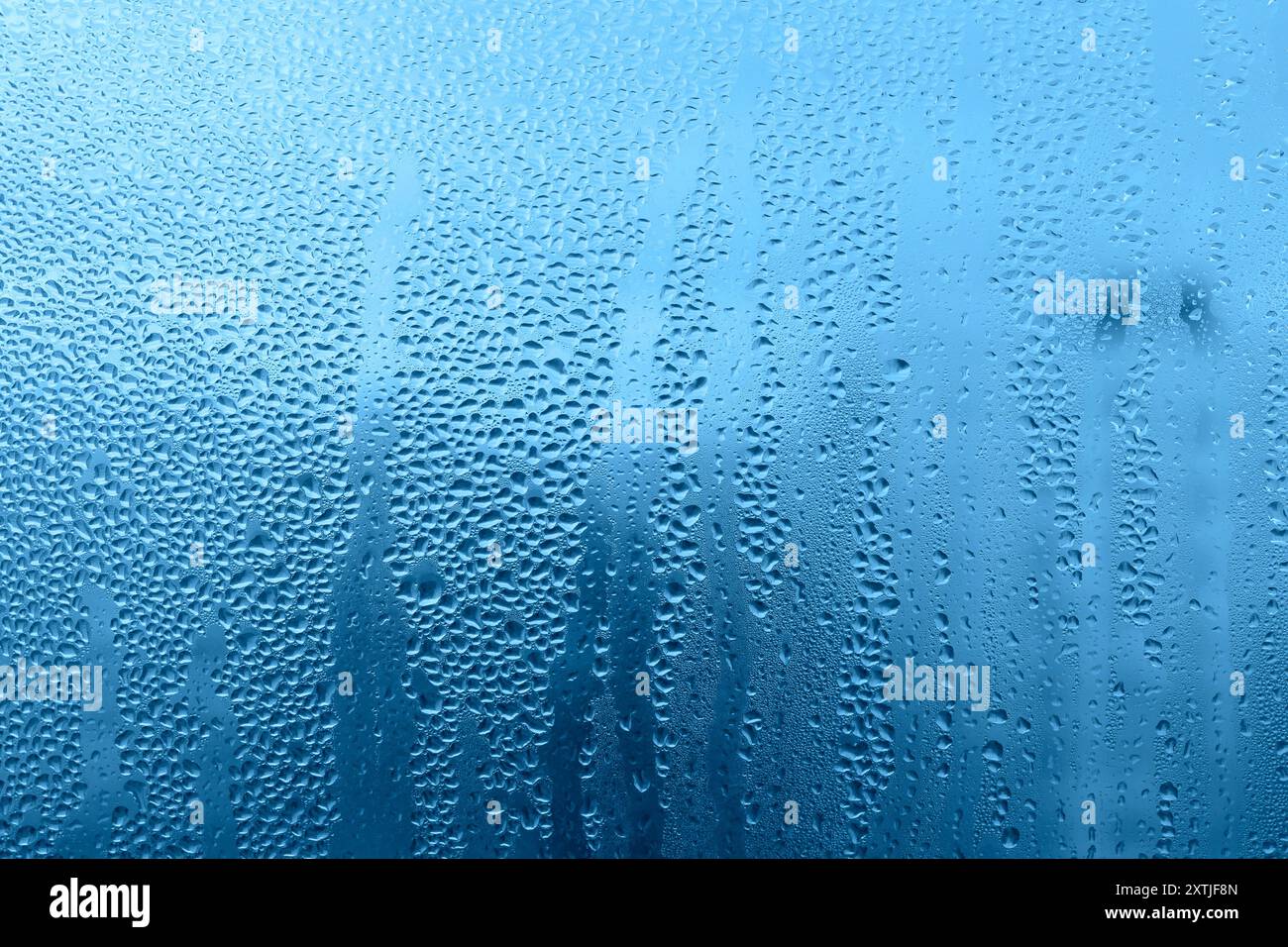 Blue background with natural water drops on glass Stock Photo - Alamy