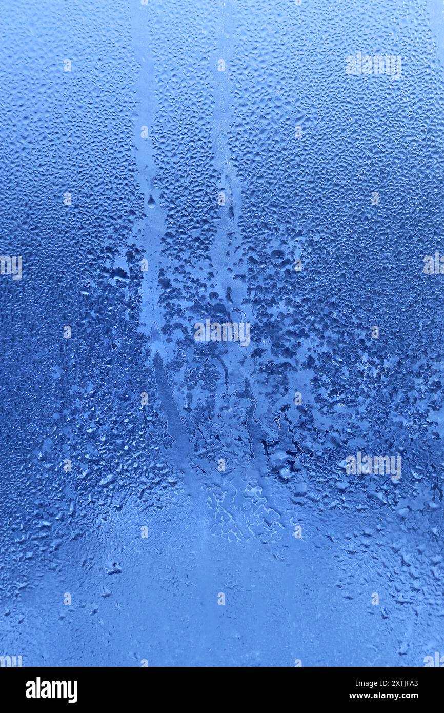 Nature background with frozen water drops on window glass Stock Photo ...