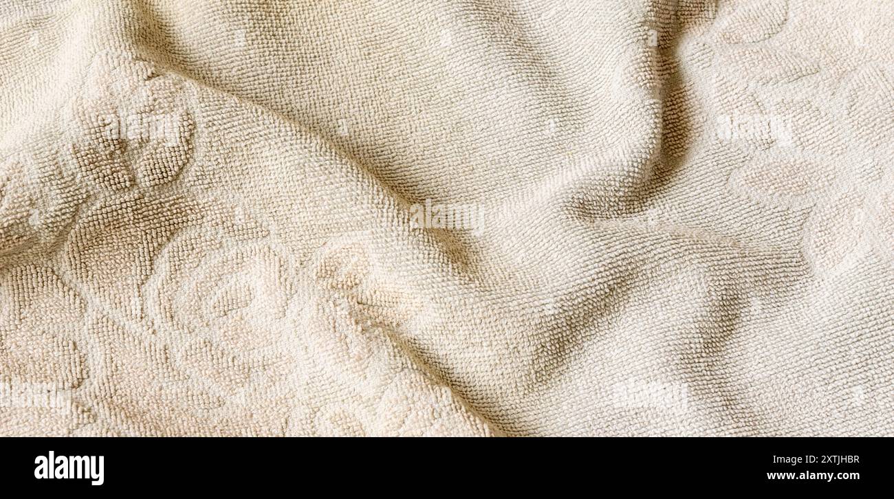 pleated creamy cotton material. texture or background Stock Photo