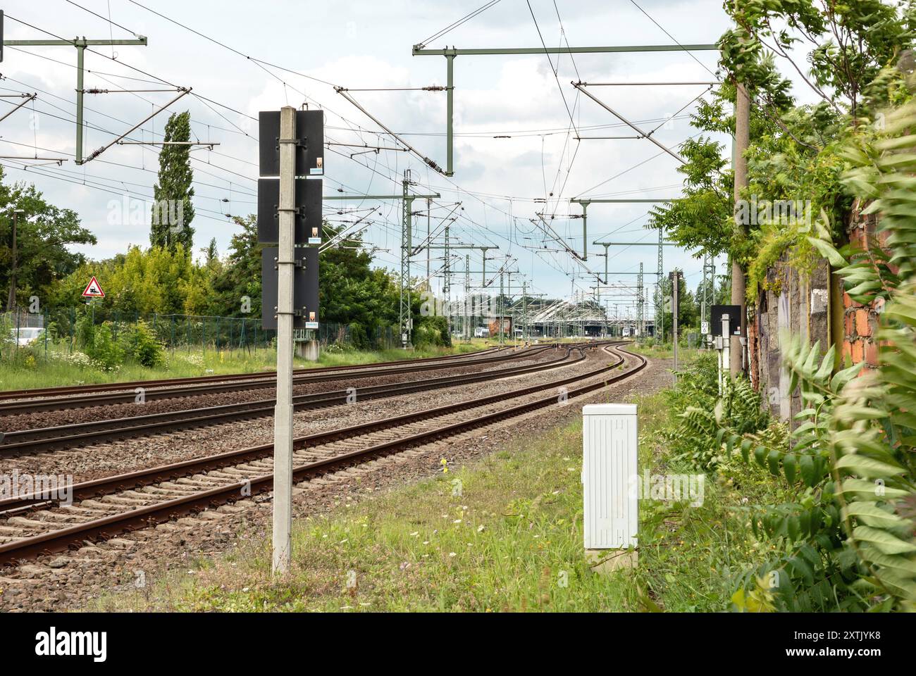 View of the tracks in the direction of the main station in Dessau, Saxony-Anhalt, Germany. View of the tracks in the direction of the main station in Dessau, Saxony-Anhalt, Germany. Technology, railroad ties, freight and passenger transportation. transport train B97A7743 Stock Photo