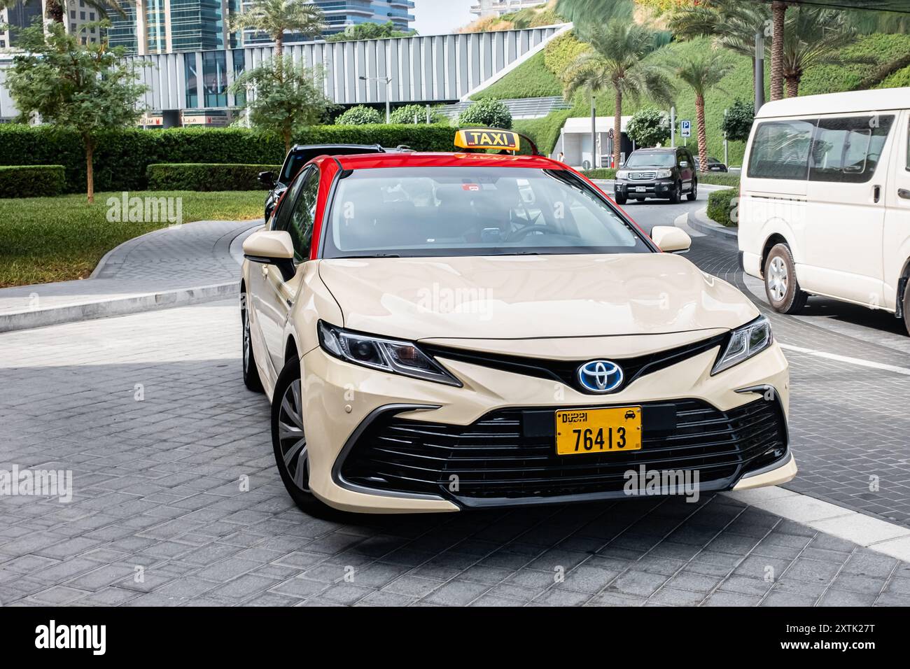 City taxi. Dubai city taxi on the city streets. Toyota taxi car parked at street. Taxi cars waiting for passengers. Jan 27,2024. Travel photo, editori Stock Photo